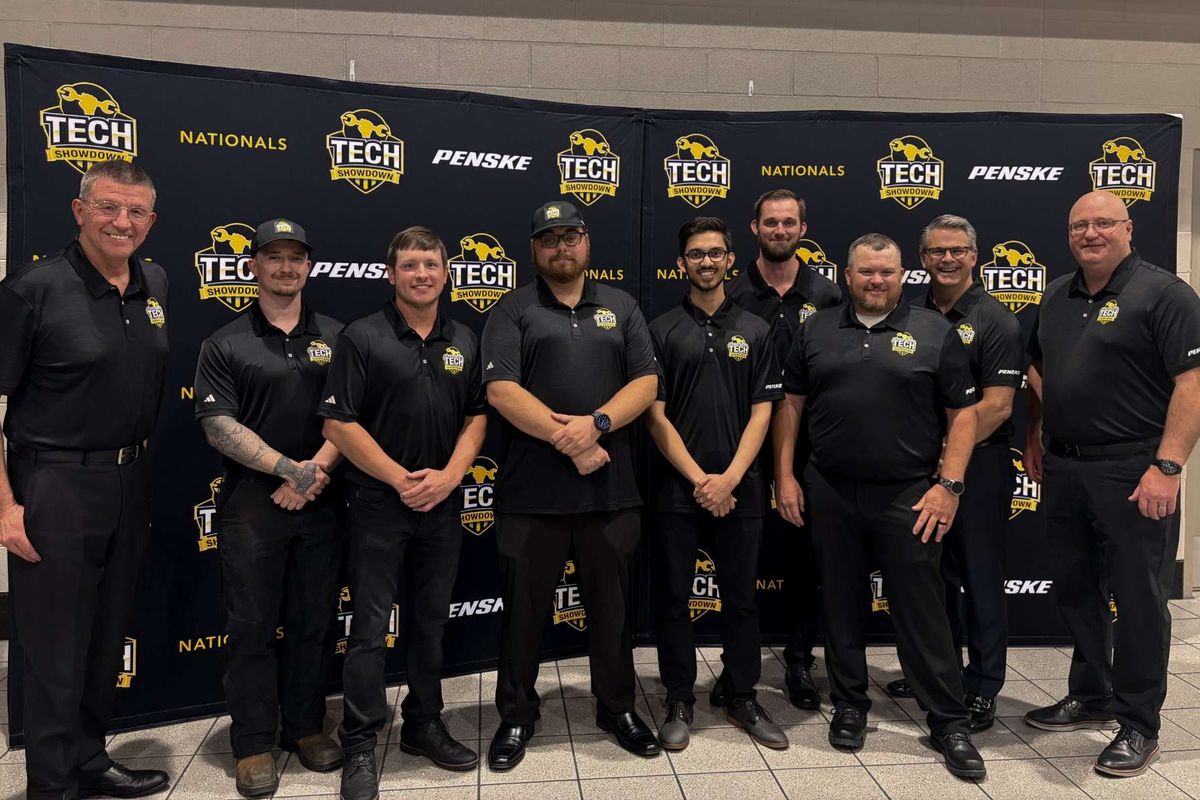 10 men standing in front of Tech Showdown backdrop