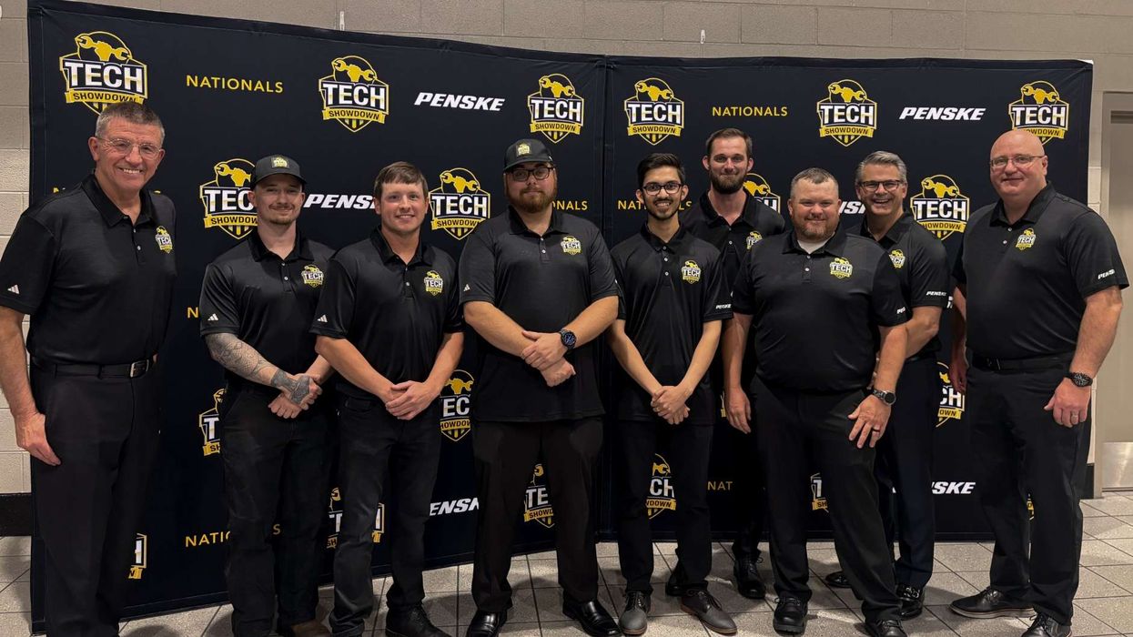 10 men standing in front of Tech Showdown backdrop