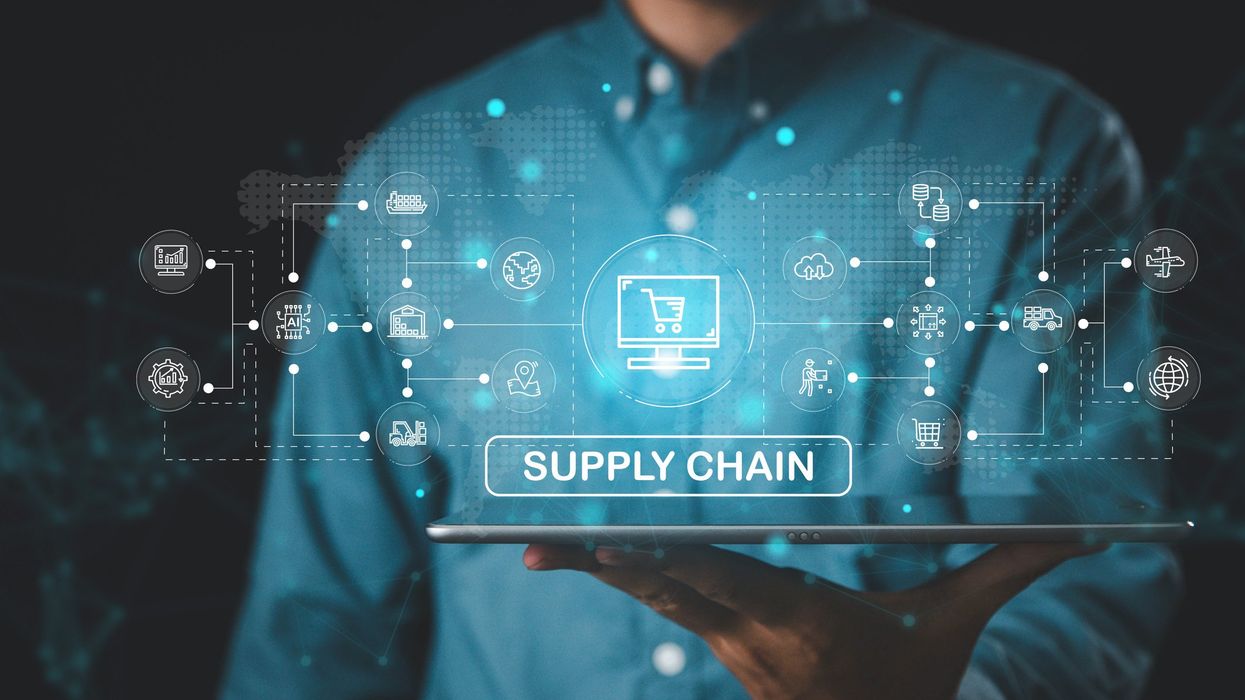A graphic of a businessman holding a supply chain graphic.