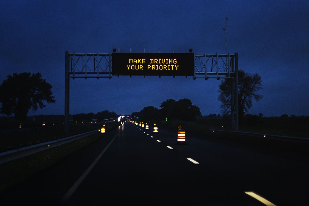 A Make Driving a Priority highway sign