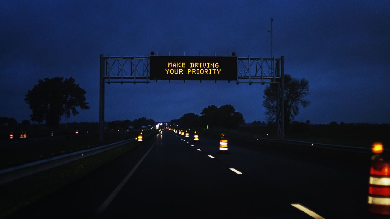 A Make Driving Your Priority highway sign
