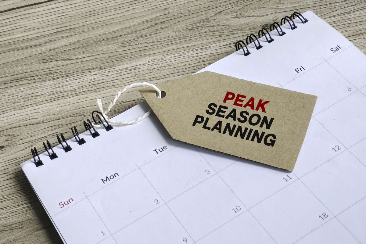 An empty calendar with a tag that reads "PEAK SEASON PLANNING"
