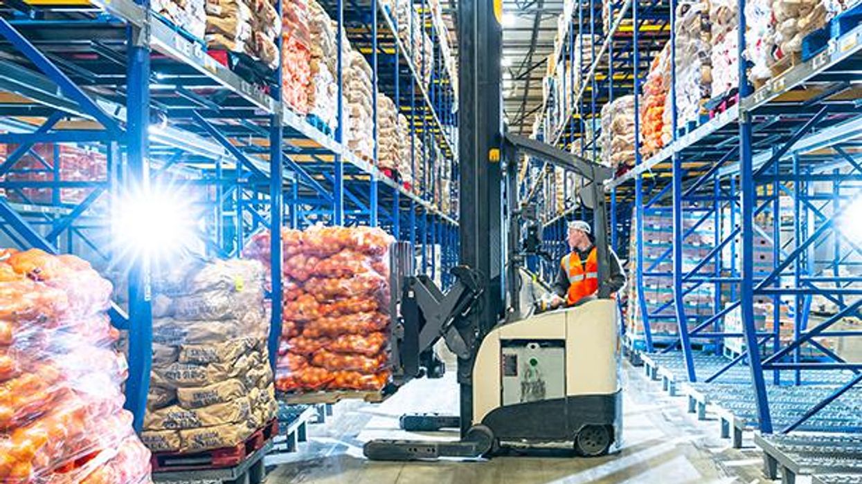 associate on a forklift in a warehouse