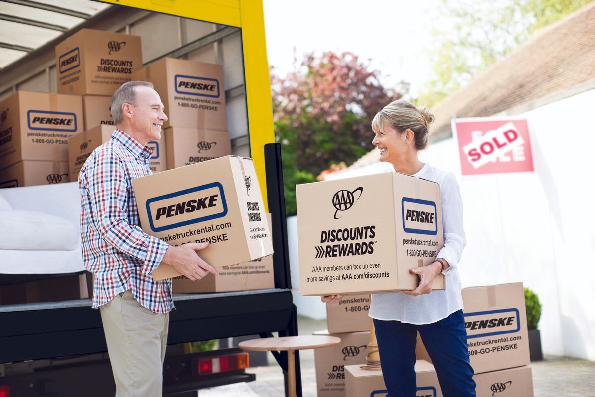 Couple unloading Penske truck
