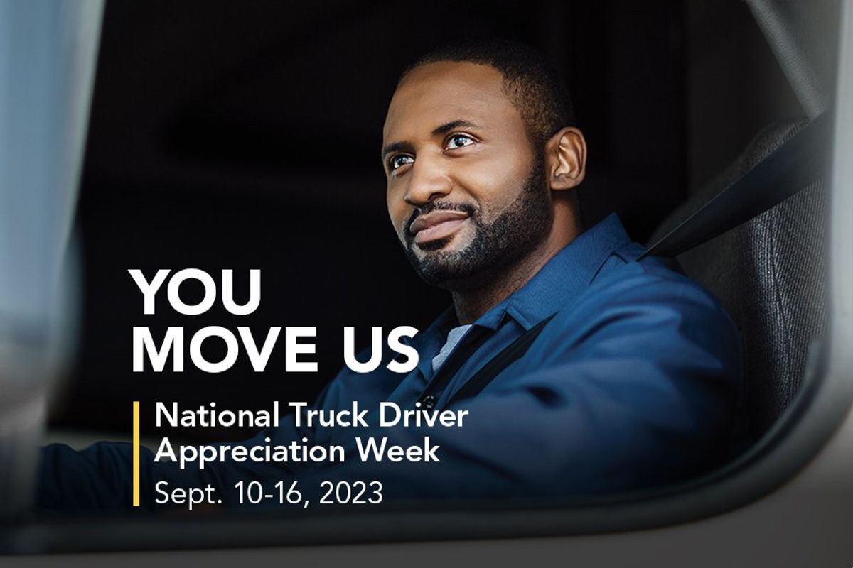 Driver in the window of a large truck