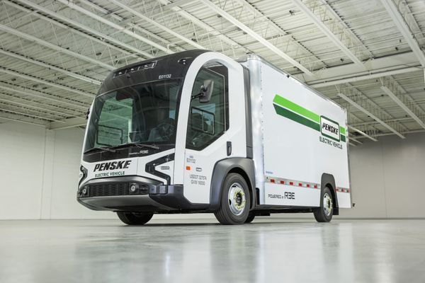 Electric truck from REE Automotive Ltd. sitting on a showroom floor.
