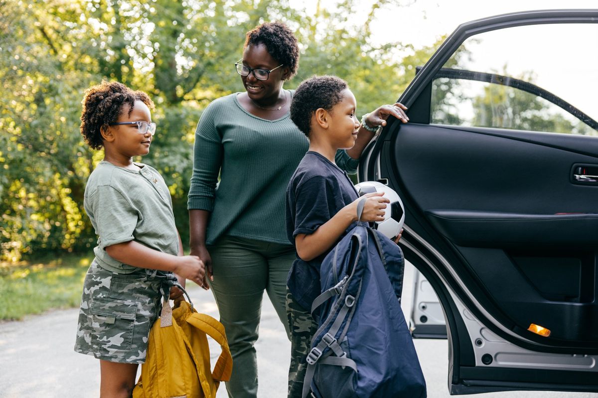 Family getting into their car.