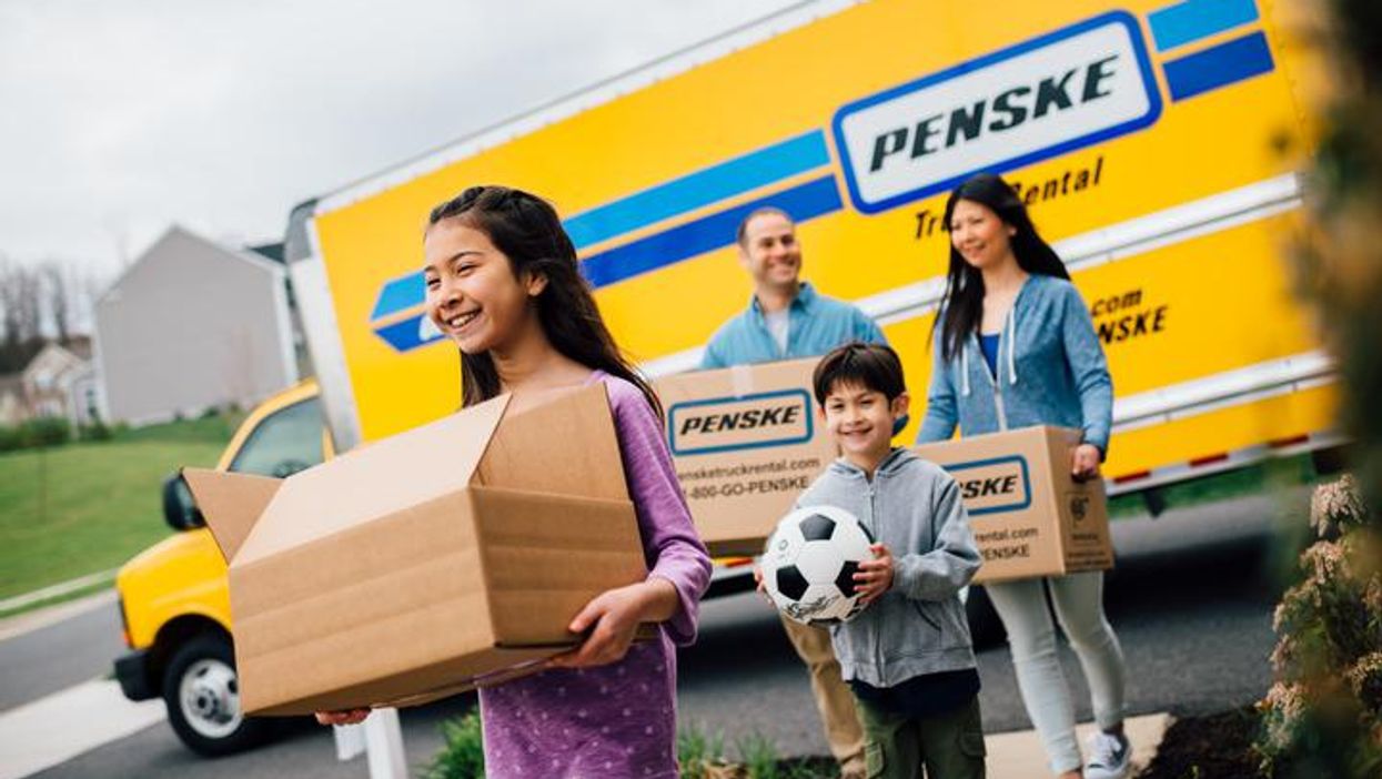 Family unloads boxes from a recent move.