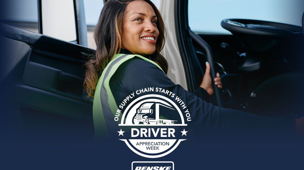 Female driver getting into a Penske truck.