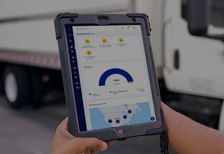 Hand holding tablet with digital experience on screen