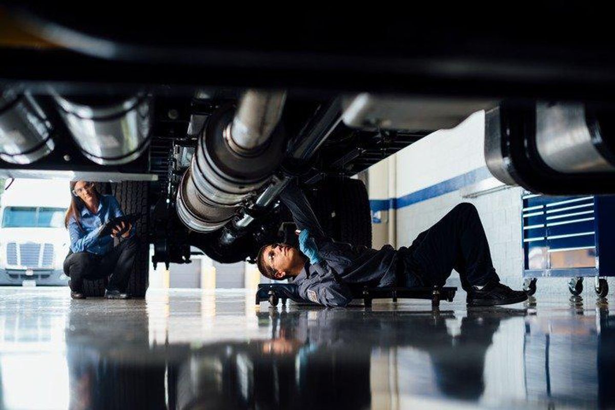 maintenance technician under truck