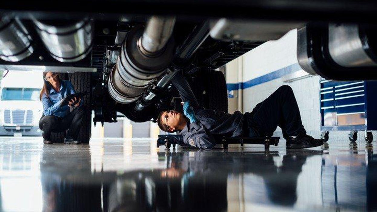 maintenance technician under truck