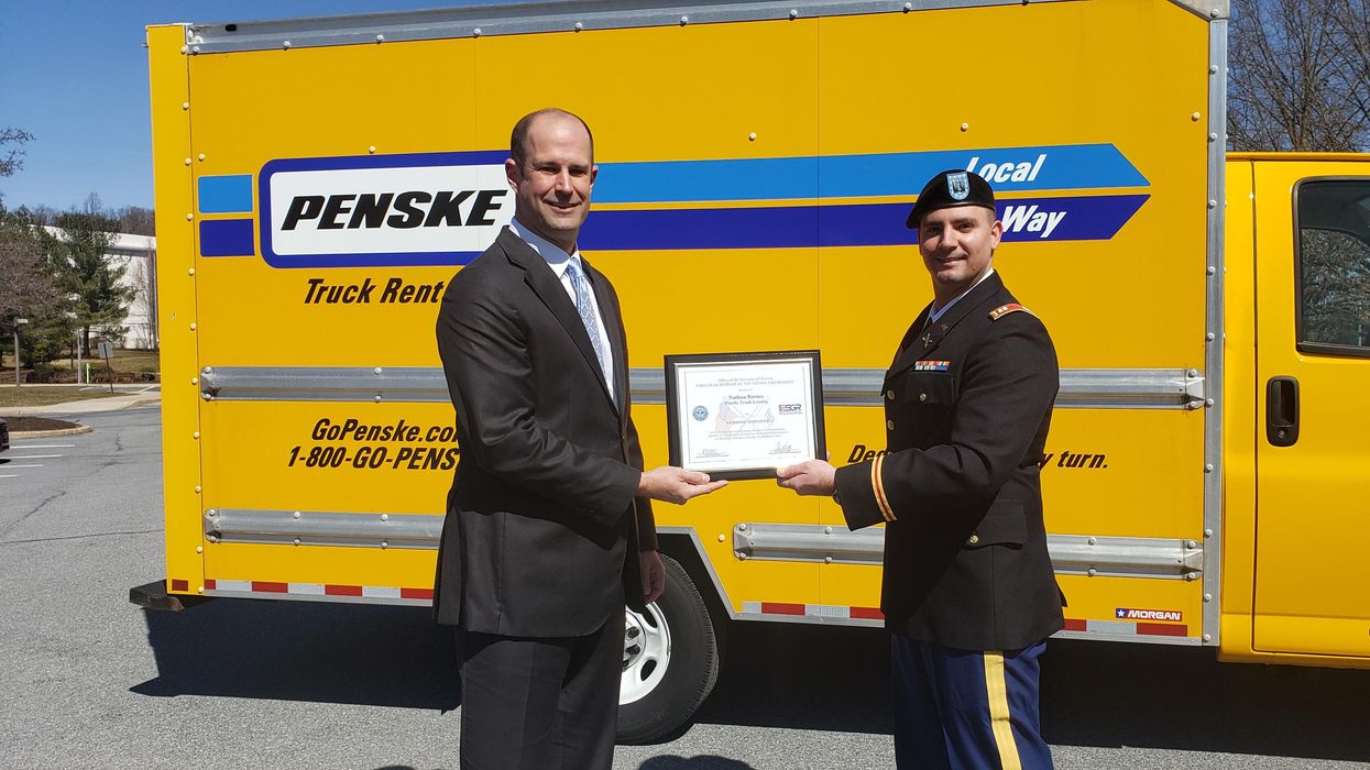 patriot award given in front of penske truck