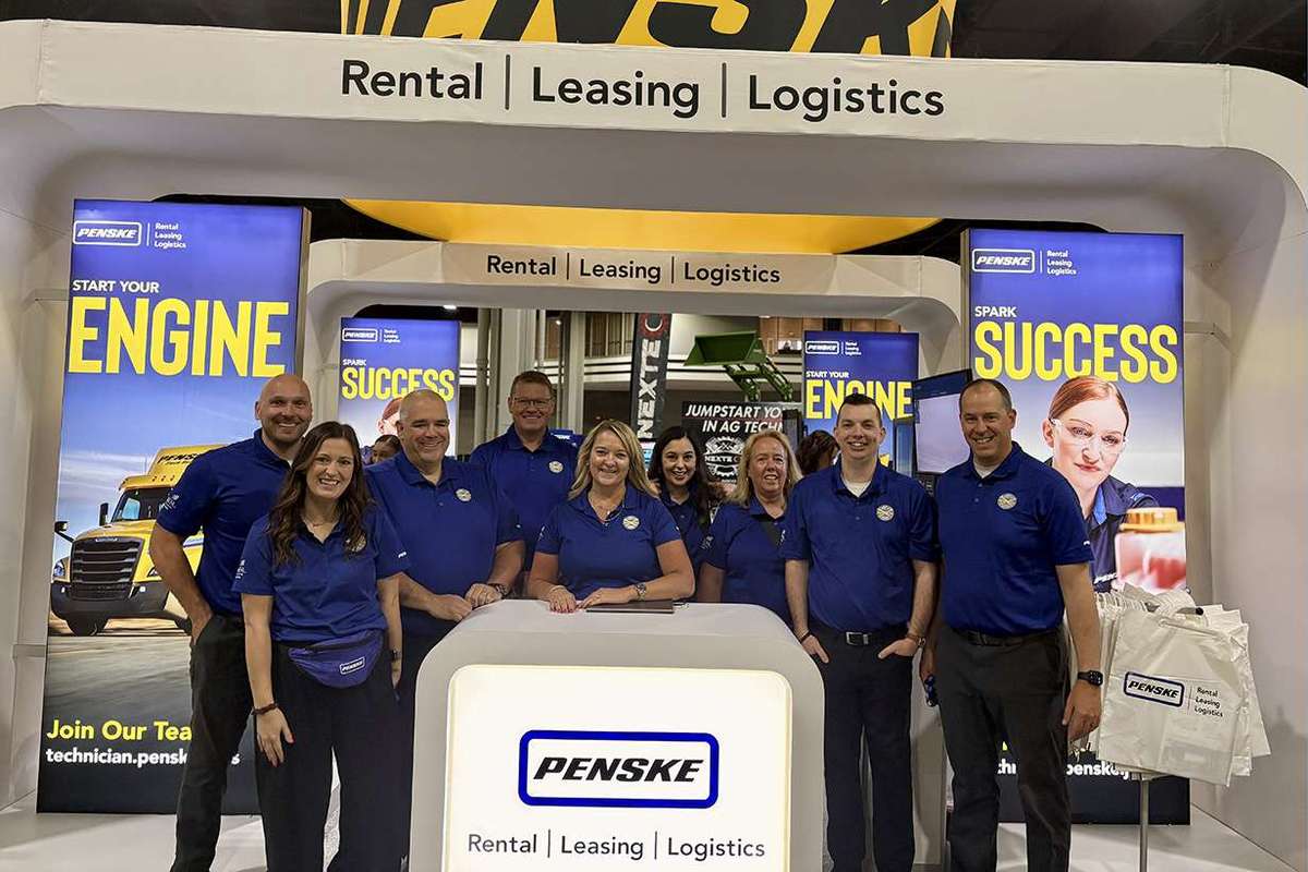 Penske associates standing at SkillSUSA booth