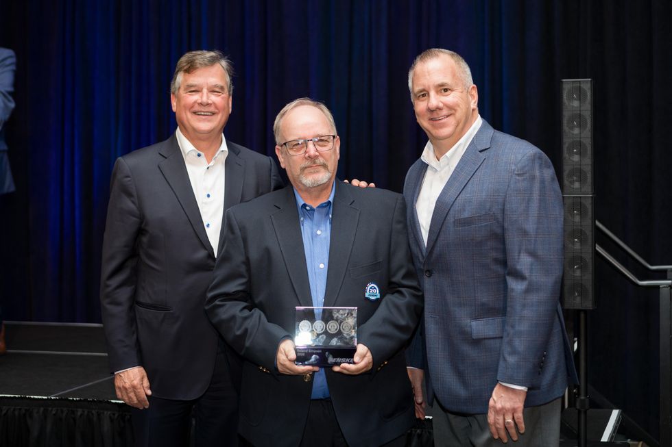 Penske Logistics Driver Wall of Fame inductee Roland Simpson poses at the driver recognition ceremony. 