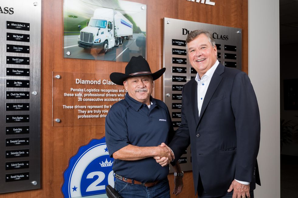 Penske Logistics Driver Wall of Fame inductee Zeke Carmona at the Diamond Class display. 