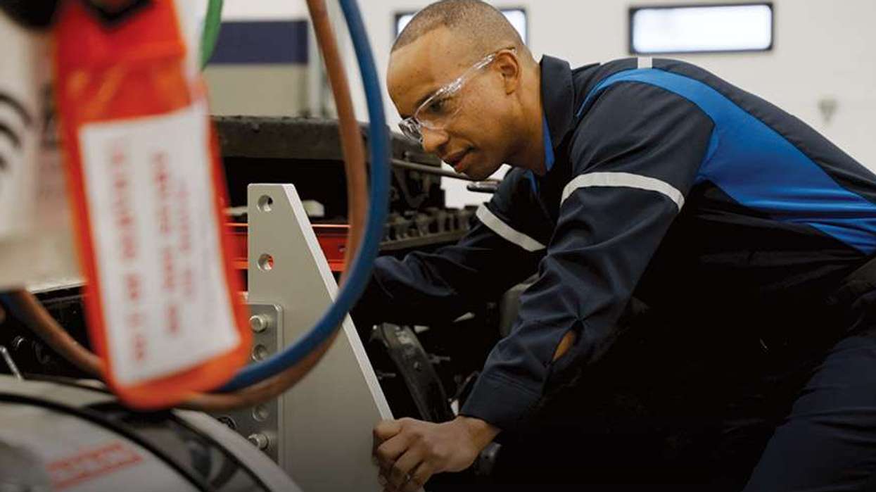 Penske technician working on a truck, highlighting National Technician Appreciation Week, June 14-20, 2026.