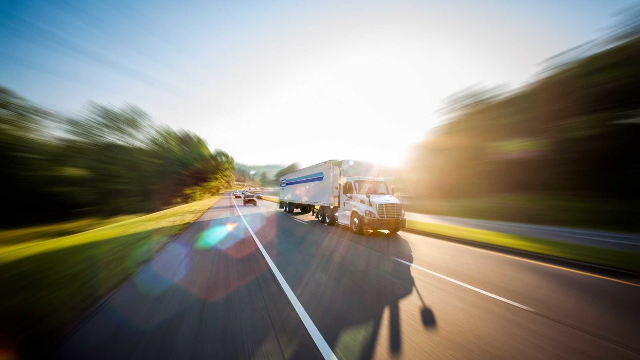 penske tractor and trailer on highway