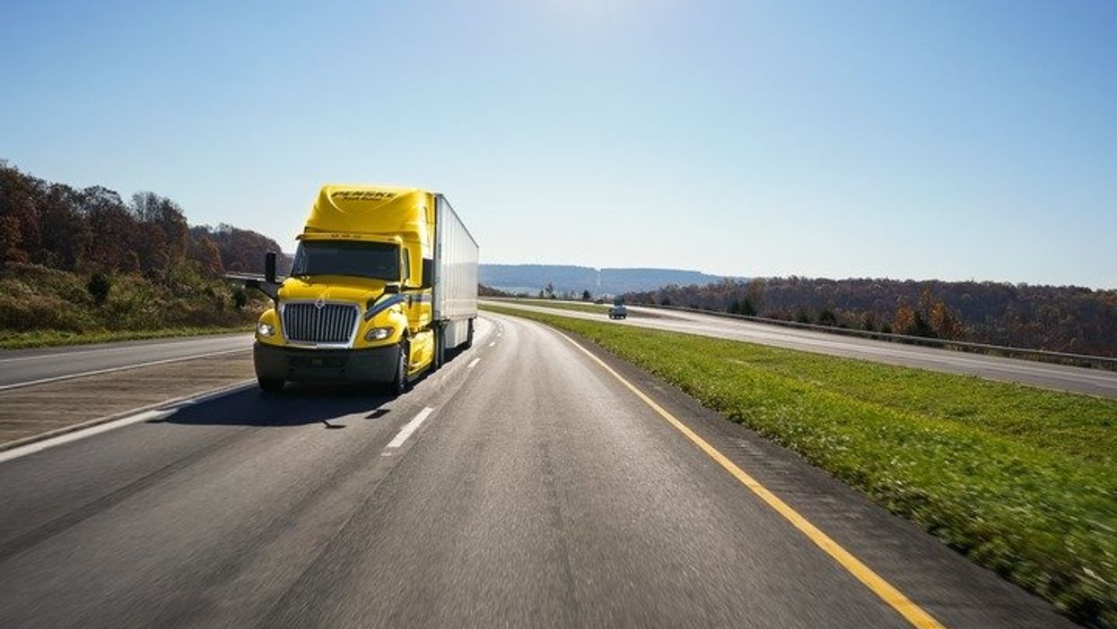Penske tractor and trailer on highway