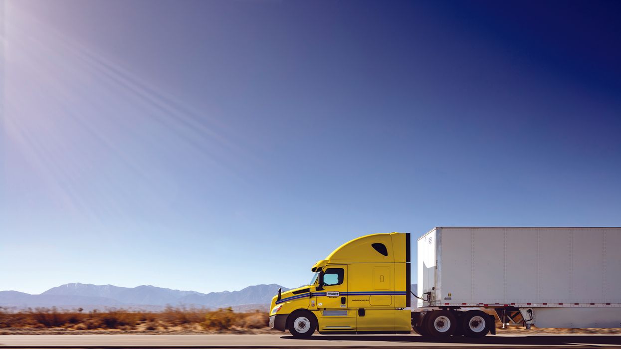 Penske tractor trailer driving on the road