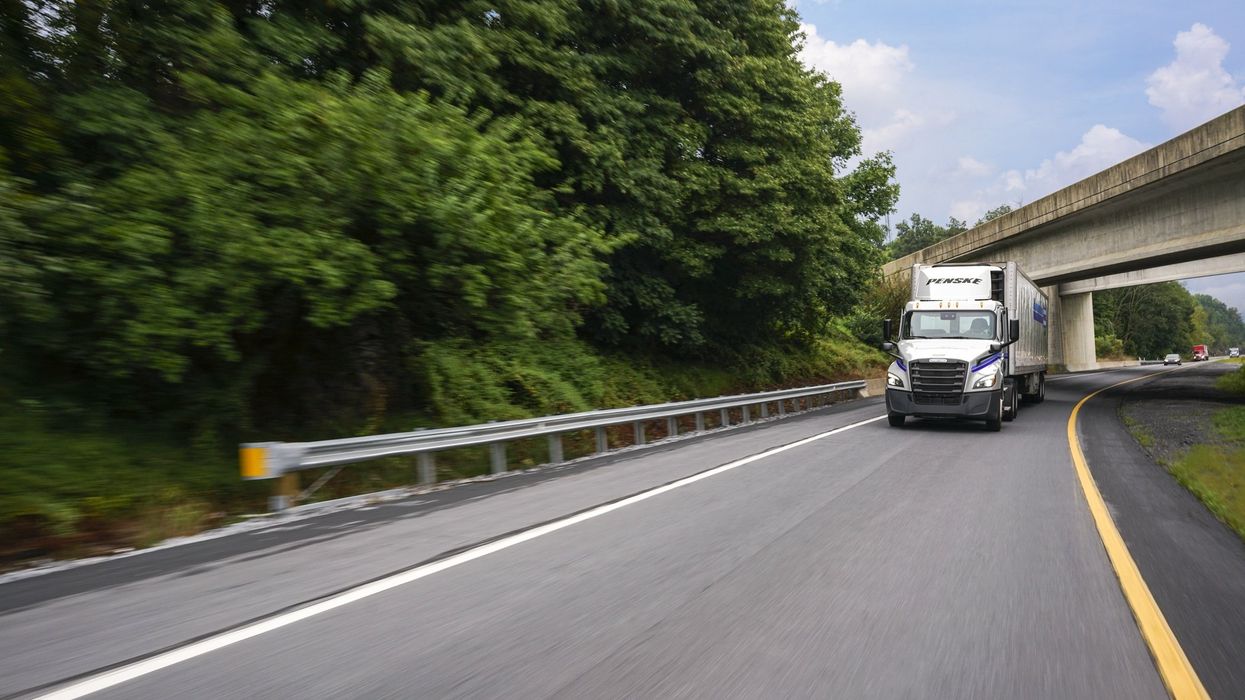 Penske truck driving on a highway