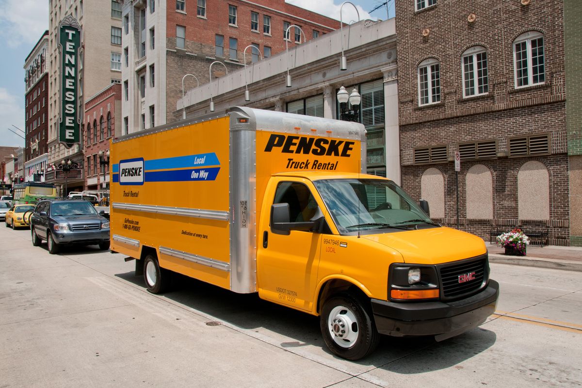 Penske truck driving through city