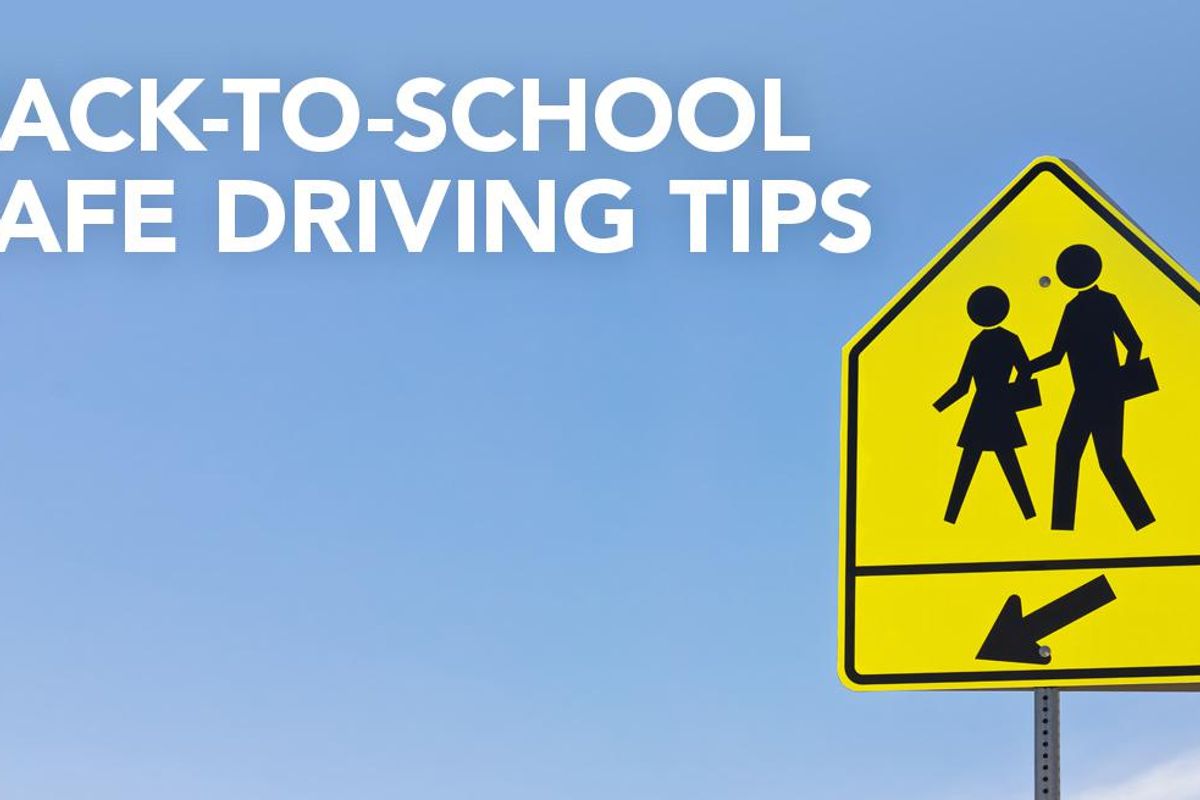 people walking street sign