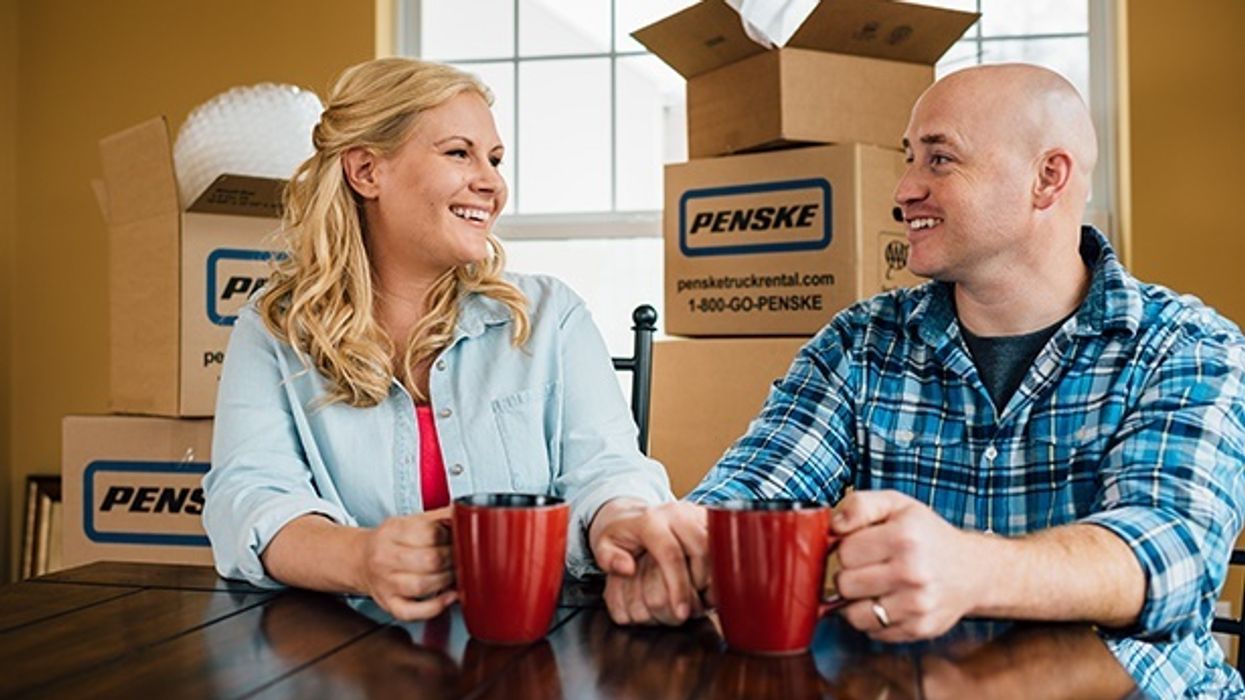 people with penske moving boxes