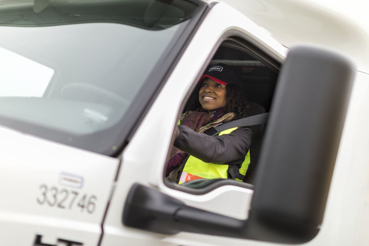 Professional truck driver wearing a seat belt