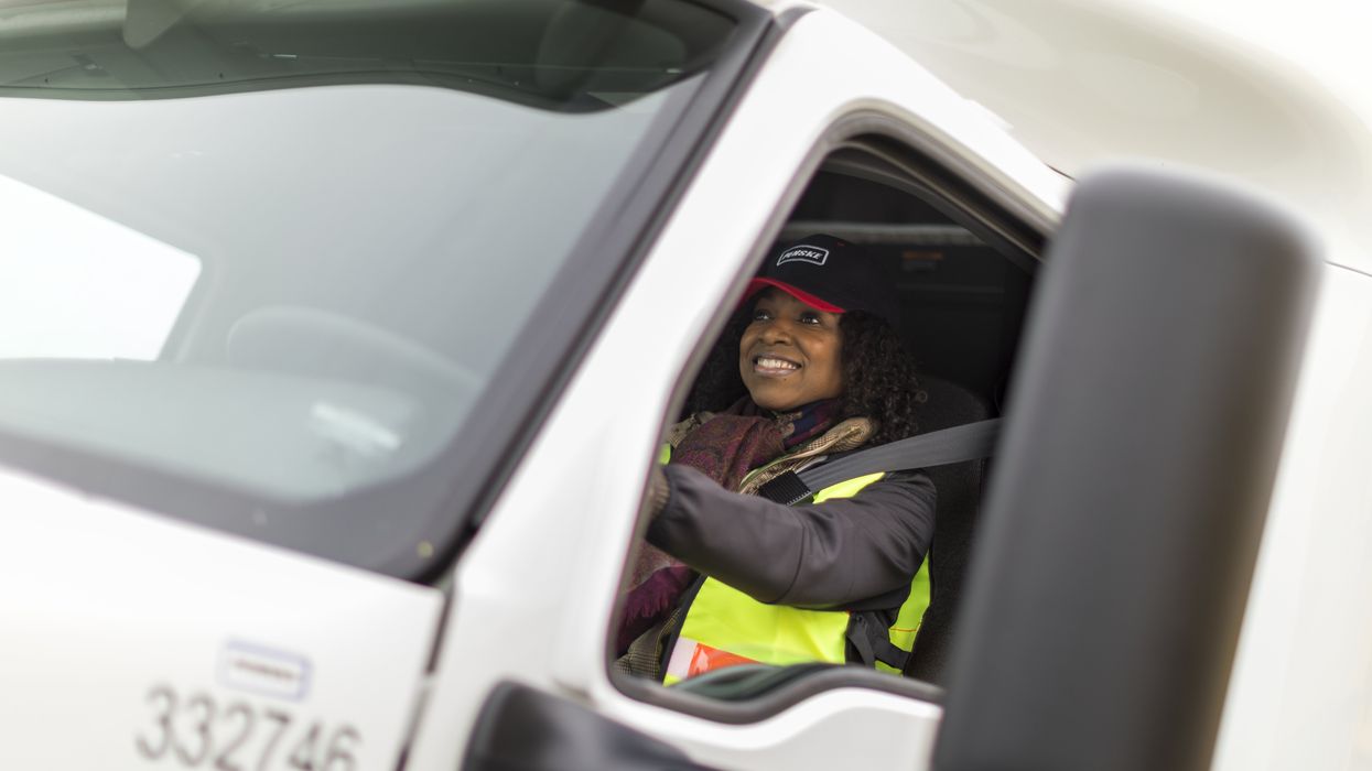 Professional truck driver wearing a seat belt