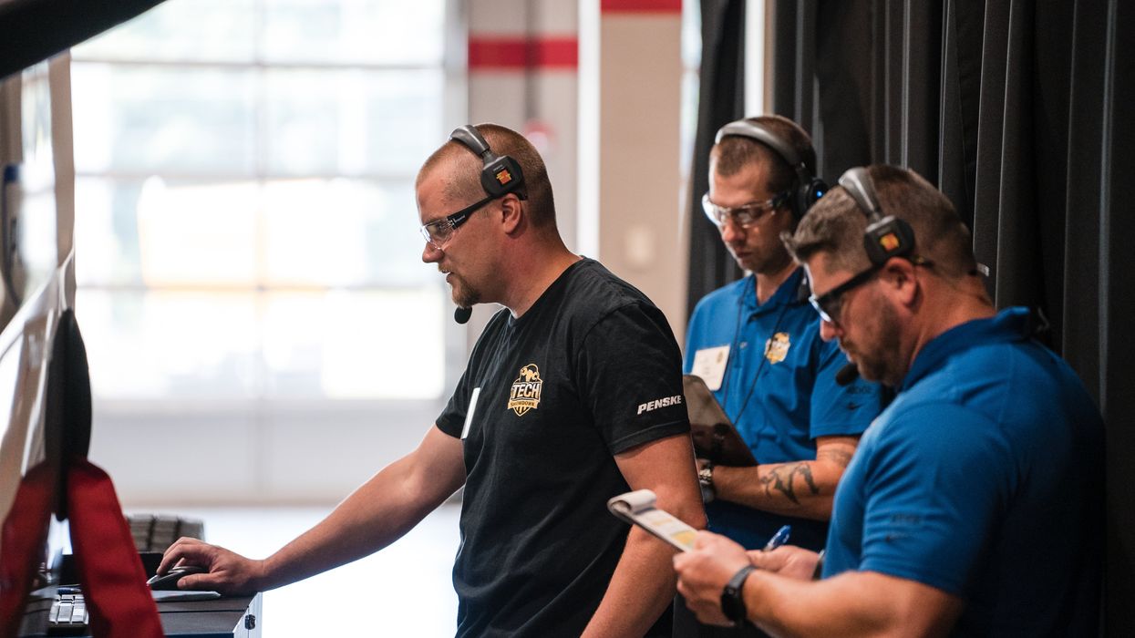 Technicians participating in a hands-on skills challenge