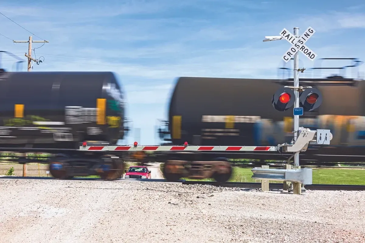 Train speeding by a truck