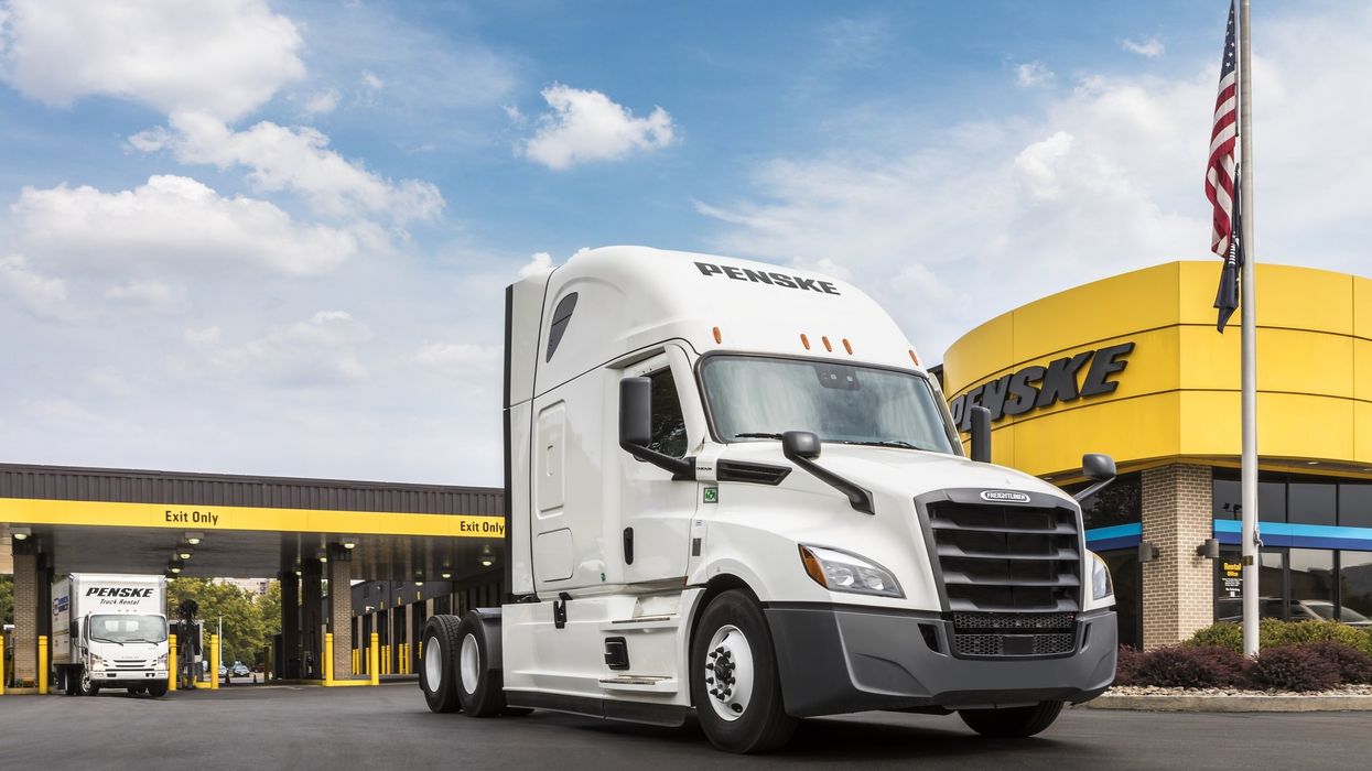 Trucks in front of a Penske building