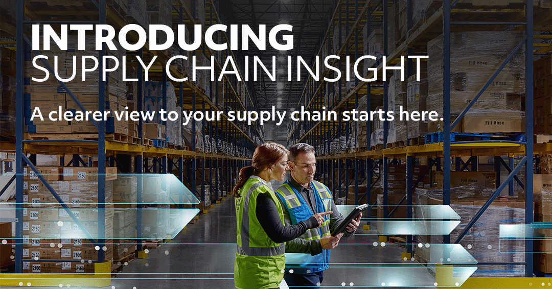 Two warehouse workers looking at a tablet