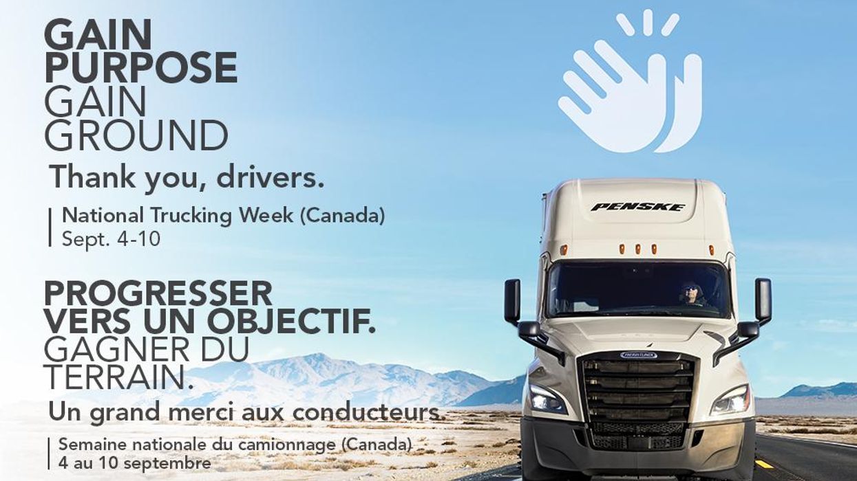 White Penske Logistics truck driving on highway.