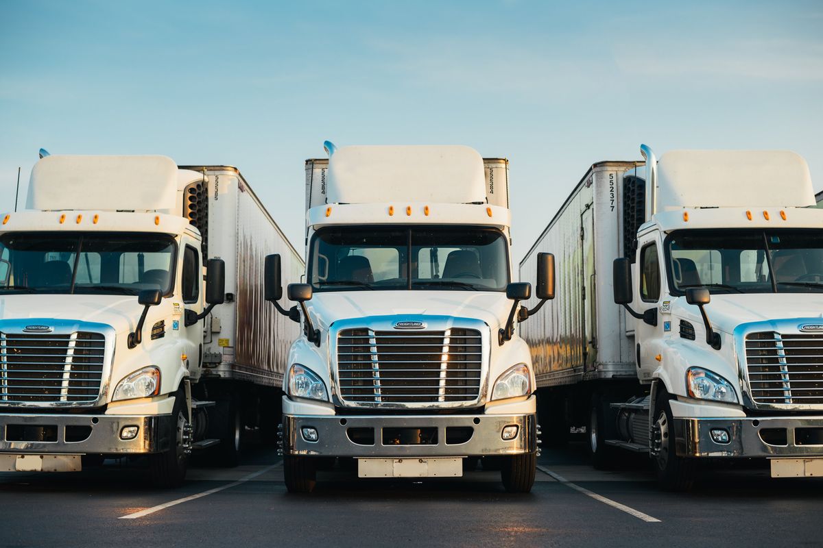 White semi-truck parked in a lot