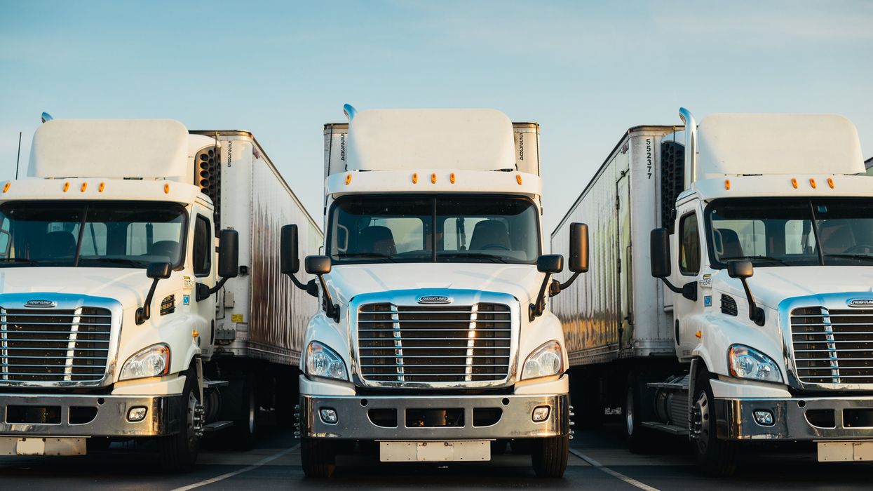 White semi-truck parked in a lot