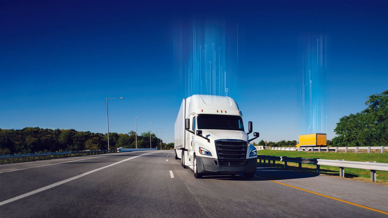 White truck driving down the highway