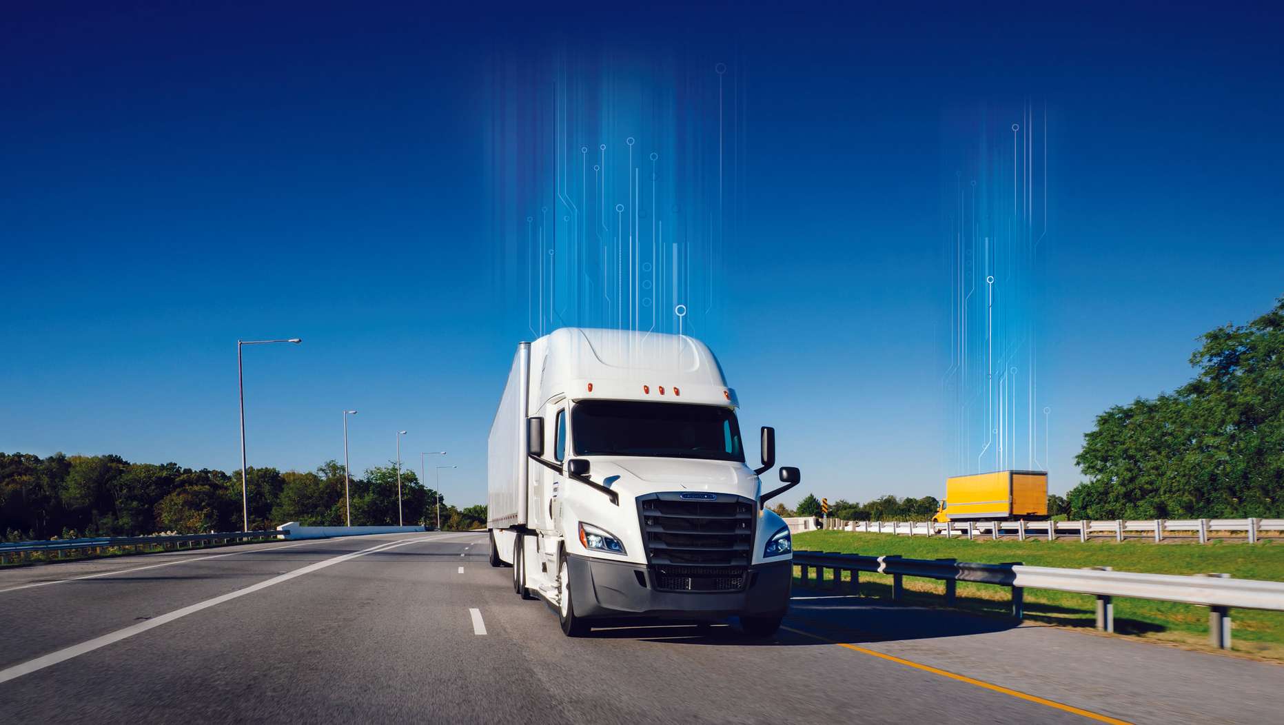 White truck driving down the highway